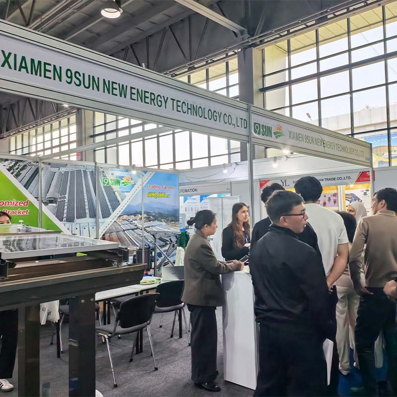 Buyer inspecting aluminium solar panel clamps and rail samples at the booth Buyer inspecting aluminium solar panel clamps and rail samples at the booth